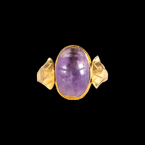 A 20th century Egyptian Revival gold ring with ancient amethyst scarab.